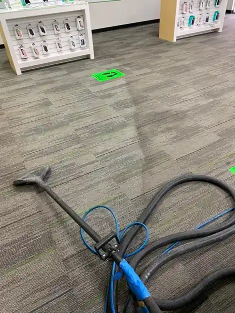 Extraction wand on commercial carpet tile