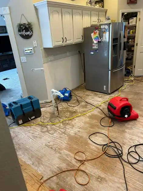 Kitchen floor opened up with drying equipment running