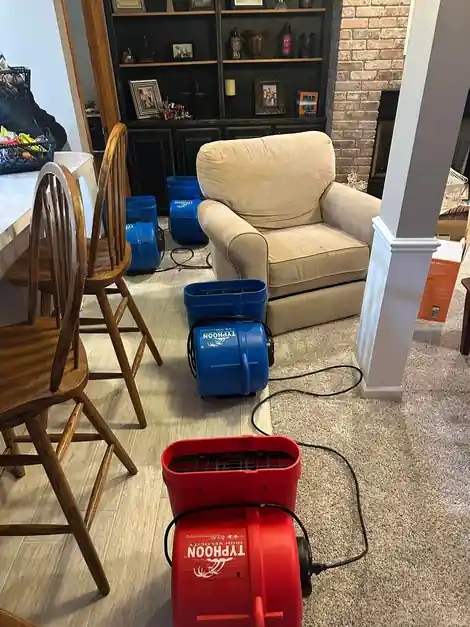 A red Typhoon air mover running in a sitting room