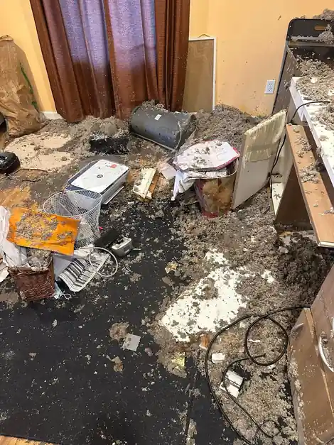 Burnt debris and soot on a counter inside a fire-damaged home