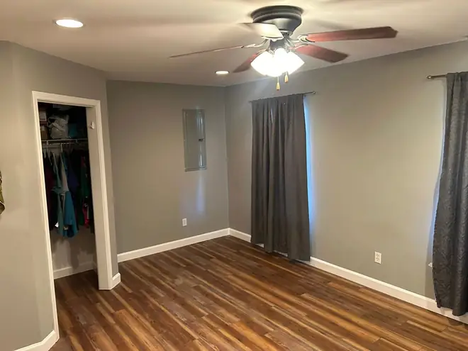 Finished bedroom with a new plank floor