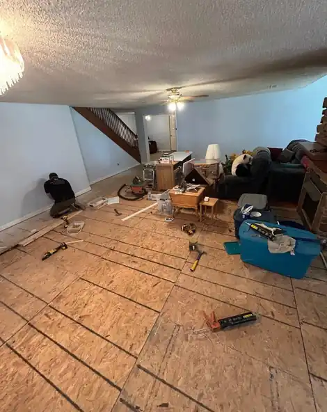 New subfloor sheathing laid as a room is rebuilt